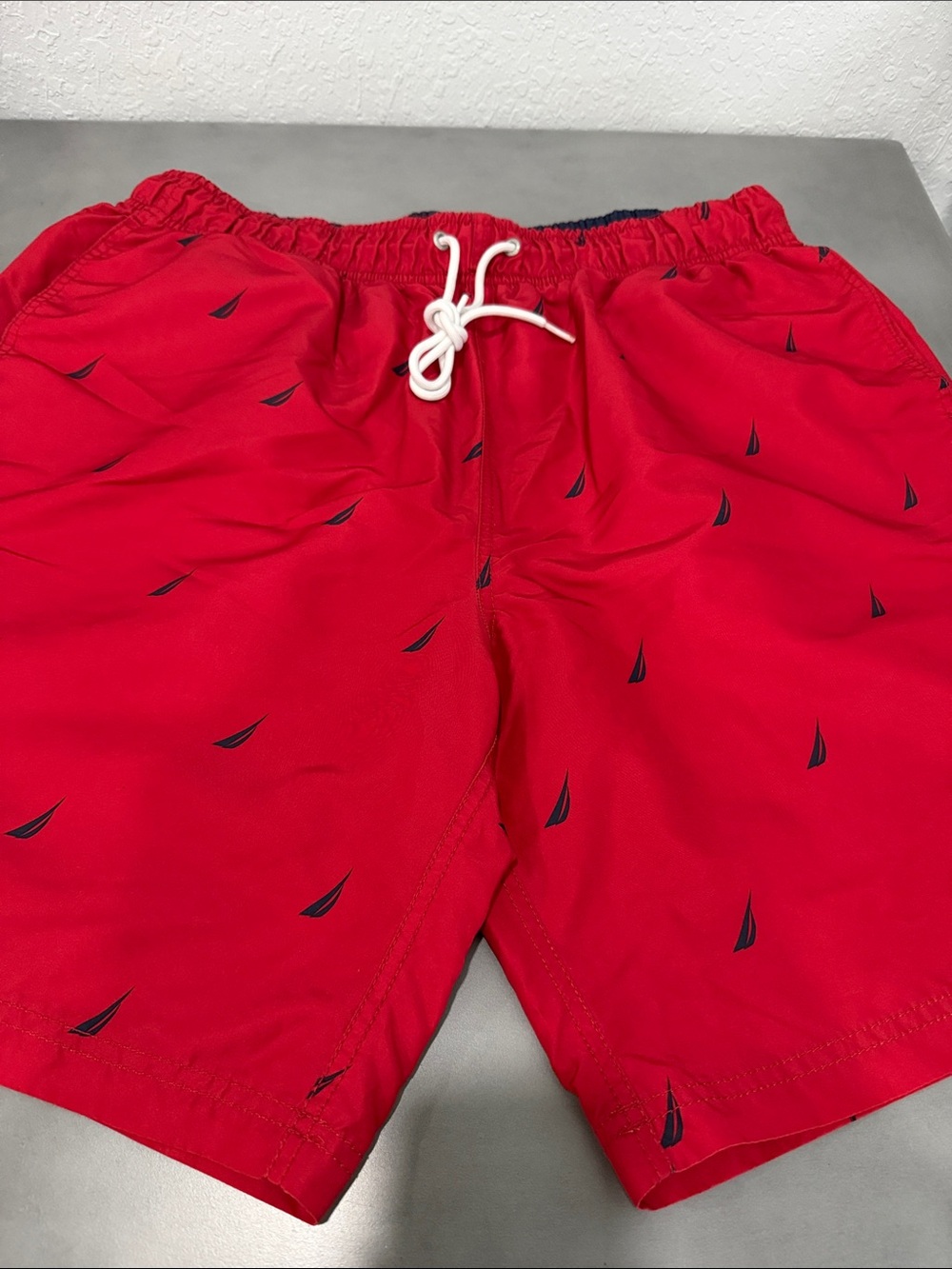 Nautica Red Swim Shorts with Navy Sailboat Motif